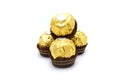 Ferrero Rocher is premium chocolate ball sweets filling with nuts and luxury delicious. Italian chocolate candies isolated on whit