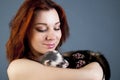 Ferret sleeping on woman's hands