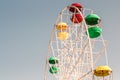 Ferris or devil wheel against blue sky background