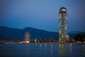 Georgia, Batumi-July 17, 2018. Ferris wheel and alphabet tower - sights of Batumi in the evening light, their outlines against the Royalty Free Stock Photo