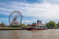 Ferris Wheel, amusement park and ferry boat in Lujan River - Tigre, Buenos Aires, Argentina Royalty Free Stock Photo