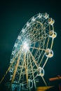 Ferris Wheel at amusement park. Part of ferris wheel against a night sky background with night lighting Royalty Free Stock Photo