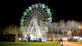 AVEIRO, PORTUGAL - CIRCA DECEMBER 2018 Fonte Nova's garden with Christmas market and colored ferris wheel near Ria de Aveiro at ni Royalty Free Stock Photo