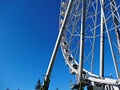 Ferris wheel on a background of blue sky