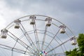 Ferris wheel on a background cloudy sky Royalty Free Stock Photo