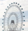 Ferris wheel on the background of the cloudy sky in the evening Royalty Free Stock Photo