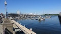 Ferris wheel in background.  Small boats on water in Old Port of Montreal Royalty Free Stock Photo