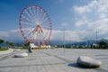 Ferris wheel on Batumi seafront with Caucasus mountains,Georgia