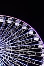 Ferris wheel in blue neon light on a dark background. Royalty Free Stock Photo