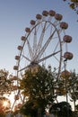 Ferris wheel on blue sky background