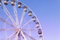 Ferris wheel on blue sky background