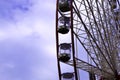 Ferris wheel on the blue sky with clouds background. Kharkiv