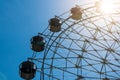 Ferris wheel with blue sky and sunset.