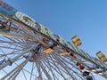 Ferris wheel, bottom view of aferris wheel against the blue sky. Royalty Free Stock Photo