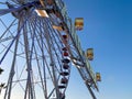 Ferris wheel, bottom view of aferris wheel against the blue sky. Royalty Free Stock Photo