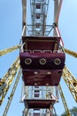 Ferris wheel cabin close-up against blue sky