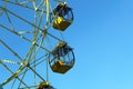 Ferris wheel with cabins closed in winter sunny weather