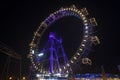 Ferris wheel carnival carousel night long exposure photography at night with blue purple and yellow illumination Royalty Free Stock Photo