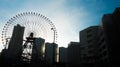 Ferris Wheel in the City silhouette blue sky Royalty Free Stock Photo