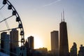 Ferris wheel with city skyline against sunset at Navy Pier,Chicago Royalty Free Stock Photo