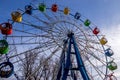 Ferris wheel with colorful cabs against the sky Royalty Free Stock Photo