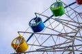 Ferris wheel with colorful cabs against the sky Royalty Free Stock Photo