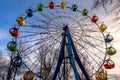 Ferris wheel with colorful cabs against the sky Royalty Free Stock Photo