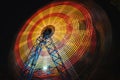 Ferris Wheel at county fair at night, motion blurred Royalty Free Stock Photo