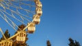 Ferris wheel at evening with moon visible Royalty Free Stock Photo