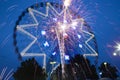 Ferris Wheel and fireworks at night Royalty Free Stock Photo