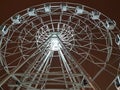 the Ferris wheel glows with lights at night. christmas in the city park Royalty Free Stock Photo