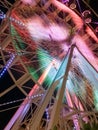 Ferris wheel illuminated at night colorful light motion Royalty Free Stock Photo