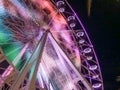 Ferris wheel illuminated at night colorful light motion Royalty Free Stock Photo