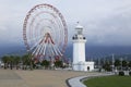 Ferris wheel and lighthouse on the seafront in Batumi