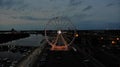 Ferris wheel lights in the evening on the boulevards