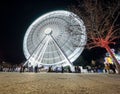 Ferris wheel in long exposure spinning and white color at the Christmas festivities.