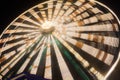 Ferris wheel in motion at the amusement park, night illumination. Long exposure Royalty Free Stock Photo