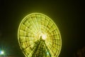 Ferris wheel in motion at the amusement park, night illumination. Long exposure Royalty Free Stock Photo