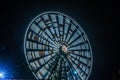 Ferris wheel in motion at the amusement park, night illumination. Long exposure Royalty Free Stock Photo