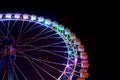 Ferris wheel with multicolor lighting against a night sky background Royalty Free Stock Photo