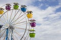 Ferris wheel with multicoloured seats.