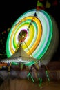 Ferris wheel at night festival in slow motion photo. High Roller.