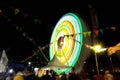 Ferris wheel at night festival in slow motion photo. High Roller.