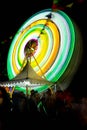 Ferris wheel at night festival in slow motion photo. High Roller.