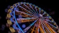 Ferris wheel at night with a motion blur and lens flares Royalty Free Stock Photo