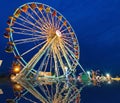 Ferris wheel with outdoor long exposure at reflect twilight. Royalty Free Stock Photo