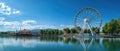 Ferris wheel overlooking the lake at an amusement park Royalty Free Stock Photo