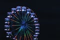 Ferris wheel for panoramic view in amusement park is popular entertaining ride in summer night Royalty Free Stock Photo