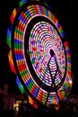 Ferris Wheel Rainbow Colors at Night Royalty Free Stock Photo