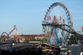 Ferris wheel and roller coaster at the Oktoberfest Royalty Free Stock Photo